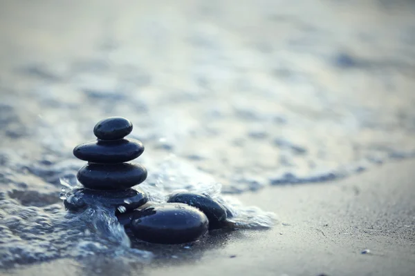 Spa stones on sea beach — Stock Photo, Image