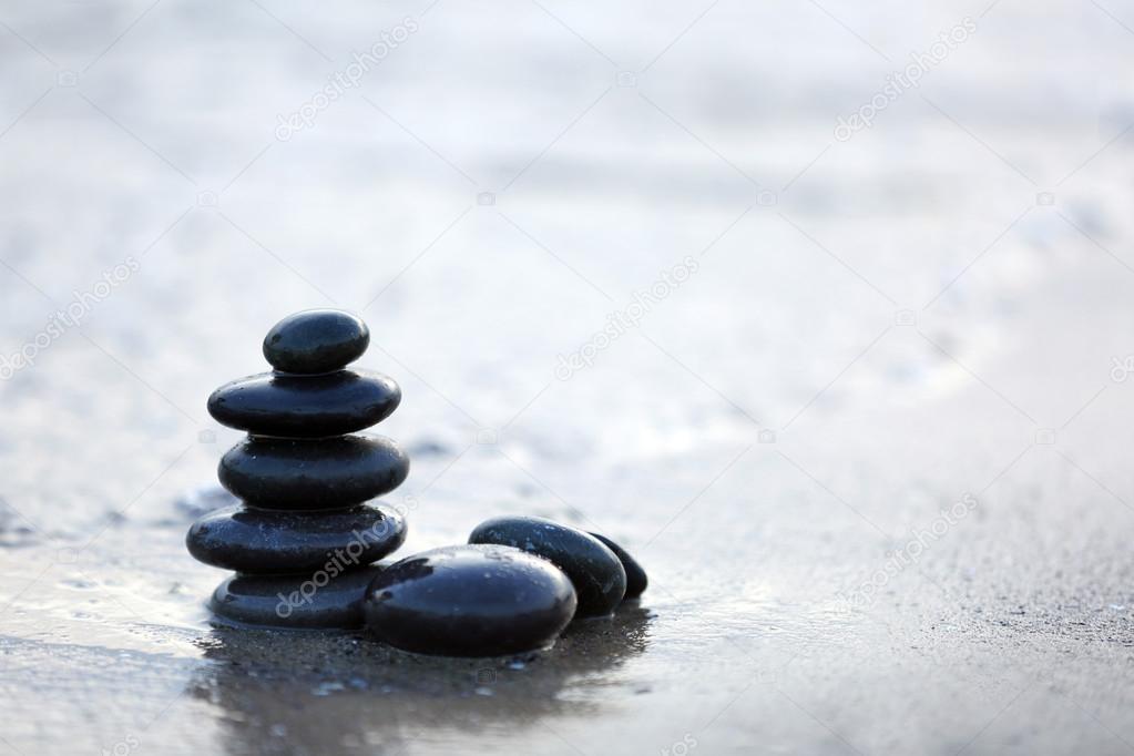 Spa stones on sea beach