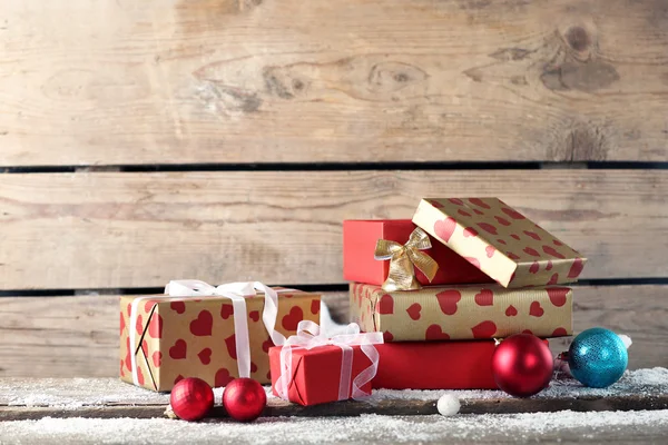 Gift boxes on wooden background — Stock Photo, Image