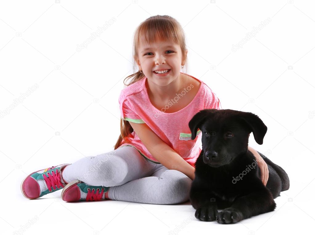 Little cute girl with puppy