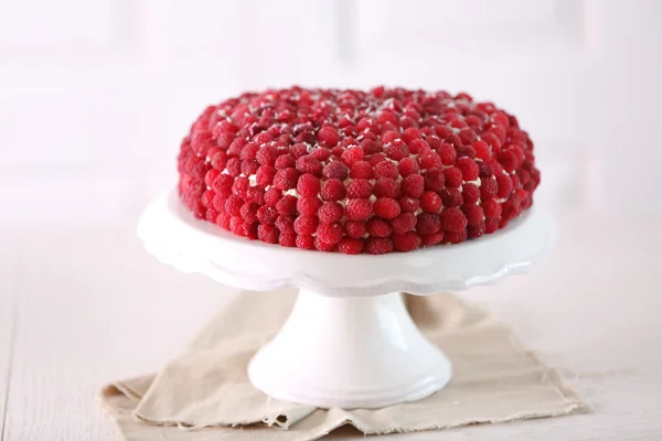 Sweet cake with raspberries on light background — Stock Photo, Image