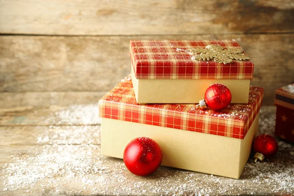 Gift boxes on wooden background — Stock Photo, Image