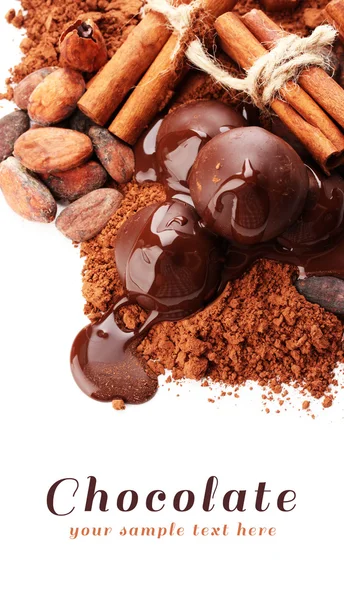 Composition of chocolate sweets, cocoa and spices, isolated on white — Stock Photo, Image