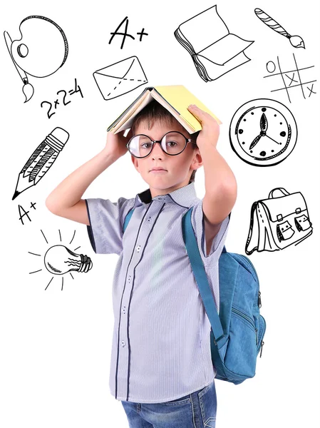 Pequeño colegial con iconos escolares, aislado en blanco —  Fotos de Stock