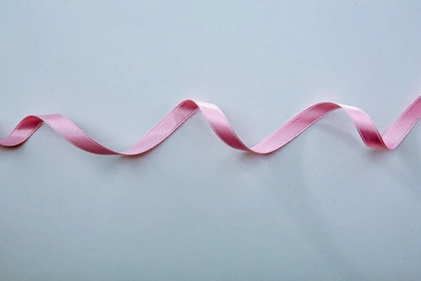 Pink ribbon isolated on white — Stock Photo, Image