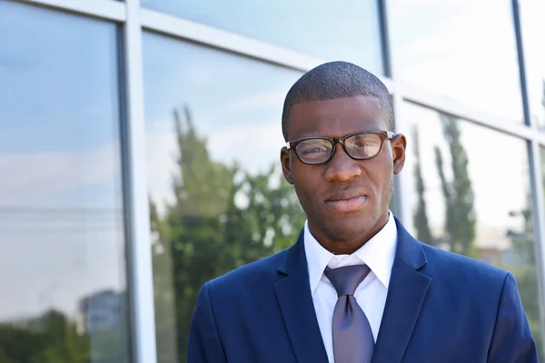 Handsome African American businessman near business centre — Stock Photo, Image