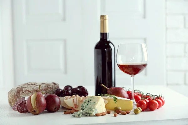 Still life with various types of Italian food and wine