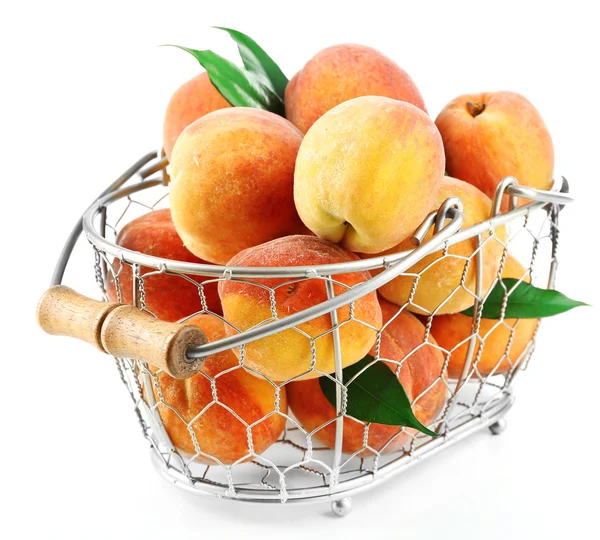 Ripe peaches in basket isolated on white — Stock Photo, Image