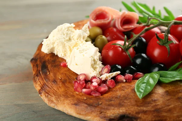 Ingredients of Mediterranean cuisine, on wooden background — Stock Photo, Image