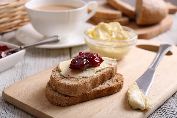 Fresh toast with butter and jam on table close up — Stock Photo, Image