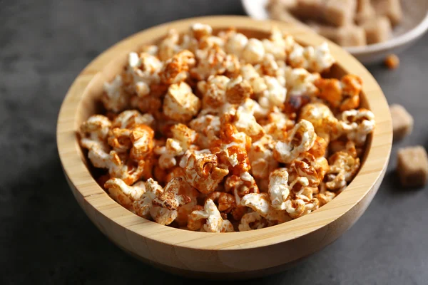 Sweet popcorn on dark background — Stock Photo, Image