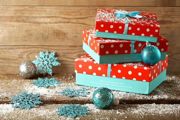 Gift boxes on wooden background — Stock Photo, Image