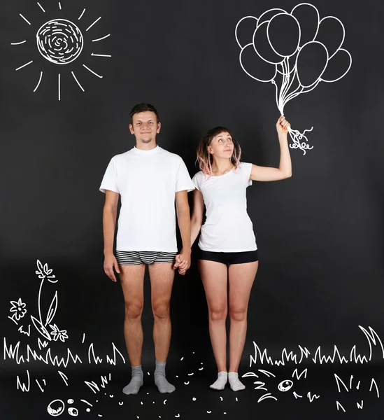 Young couple with balloons — Stock Photo, Image