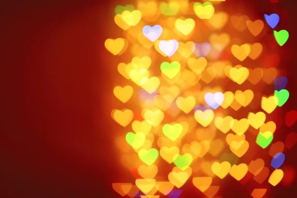 Festive background of lights in hearts shape — Stock Photo, Image