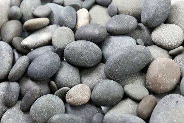 Gray sea pebbles background clipart