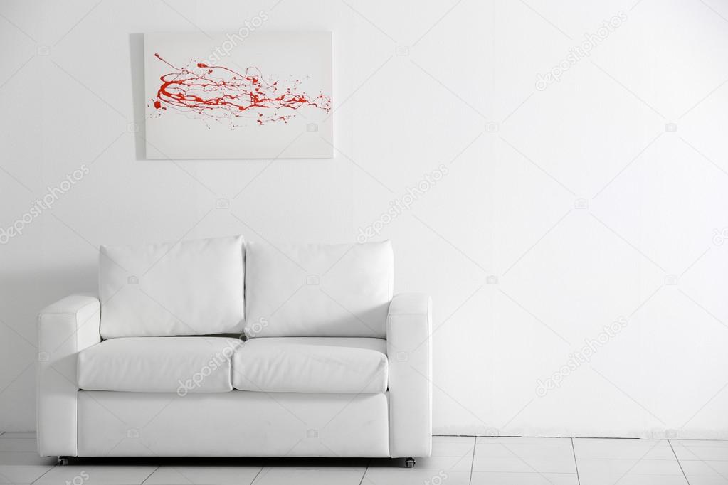 Sofa on white wall background Stock Photo by ©belchonock 86128650