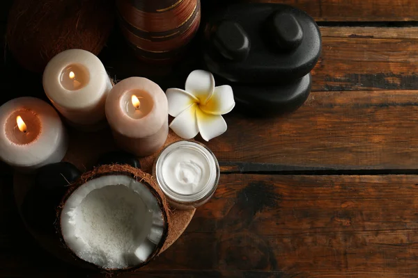 Spa coconut products on dark wooden background — Stock Photo, Image