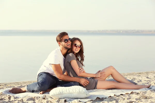 Young couple on the riverside — Stock Photo, Image