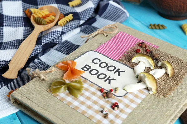 Decorated cookbook on wooden background — Stock Photo, Image