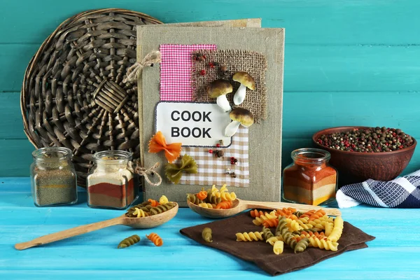 Decorated cookbook on blue  background — Stock Photo, Image