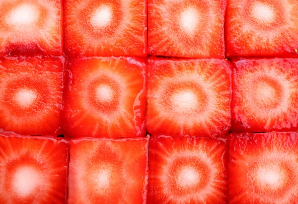 Fresh sliced strawberries cubes close up — Stock Photo, Image