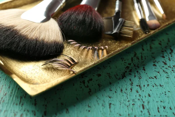 Make up brushes on wooden table closeup — Stock Photo, Image