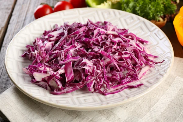 Red cabbage salad served on plate closeup — Stock Photo, Image