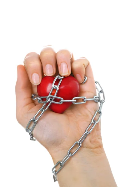 Heart shape with metal chain in female hand, isolated on white — Stock Photo, Image