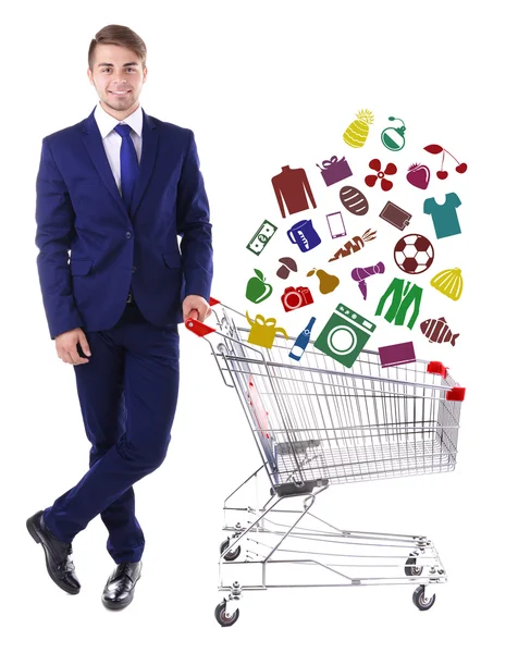 Young man holding shopping cart — Stock Photo, Image