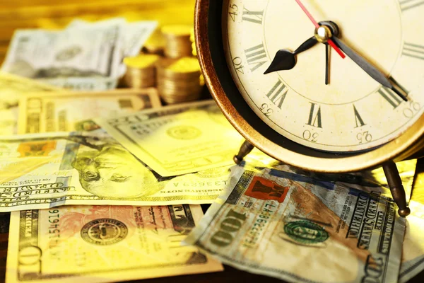 Money and alarm clock — Stock Photo, Image