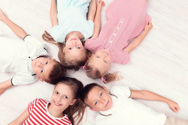 Children in circle on floor — Stock Photo, Image
