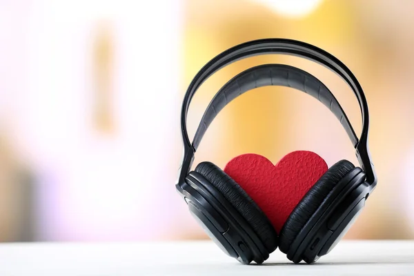 Black headphones with heart — Stock Photo, Image