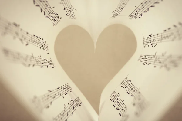 Pages curved into heart shape — Stock Photo, Image