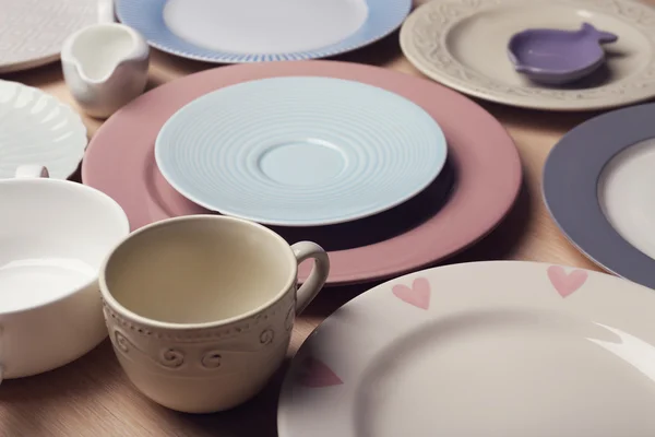 Composition of tableware on rosy background — Stock Photo, Image