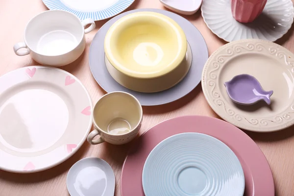 Composition of tableware on rosy background — Stock Photo, Image
