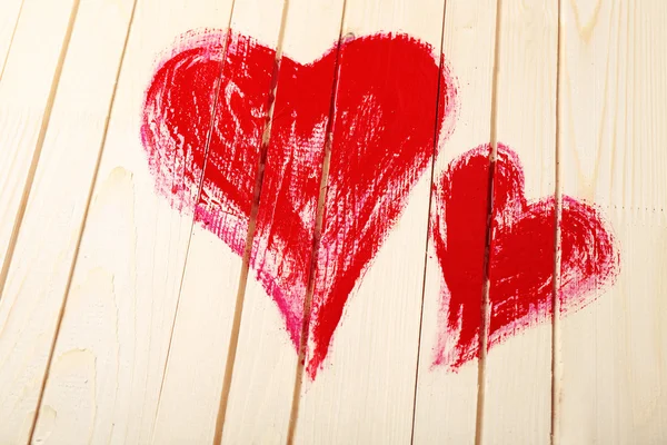 Hearts painted on wooden wall — Stock Photo, Image