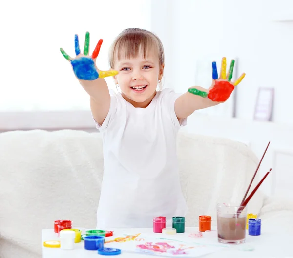 Little girl with hands in paint — Stock Photo, Image