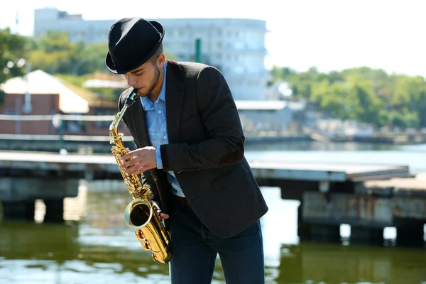Young man with saxophone — Stock Photo, Image
