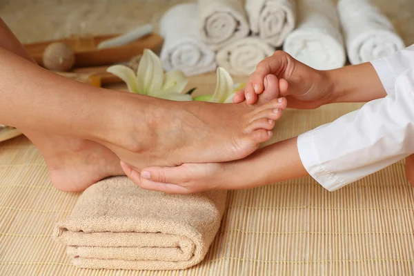 Feet massage in spa salon Stock Image