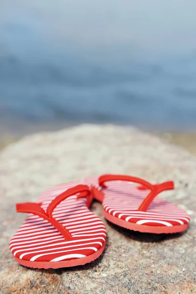 Bright flip-flops on stone — Stock Photo, Image