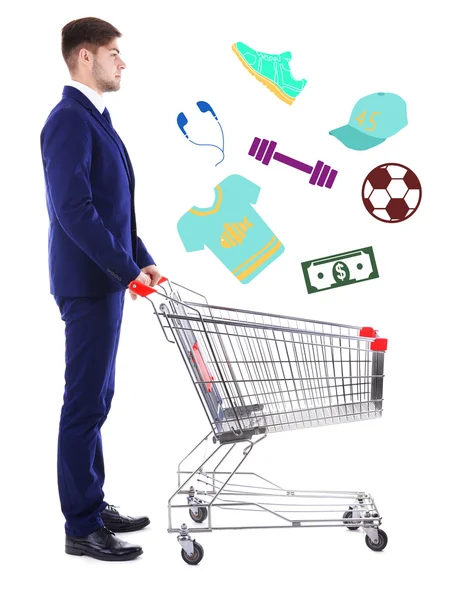 Young man pushing shopping cart — Stock Photo, Image