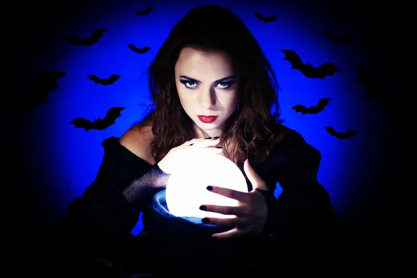 Witch on dark background — Stock Photo, Image