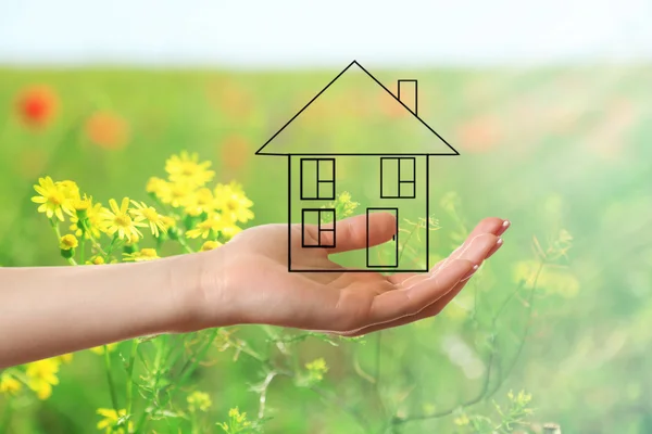 Hand holding eco house icon — Stock Photo, Image