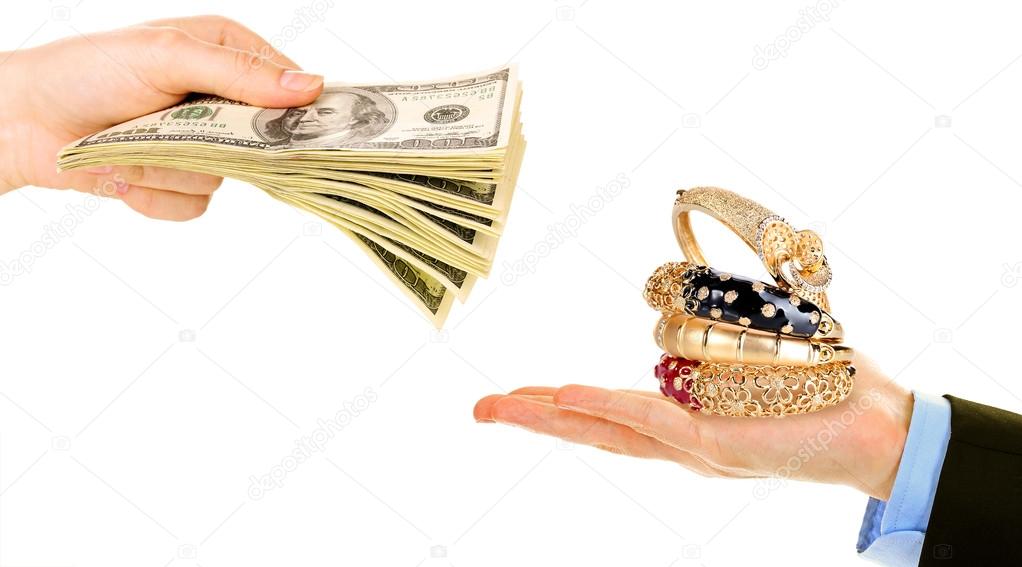 Jewelry and money on hands