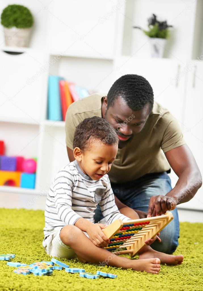 Father and son paying  