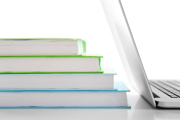 Stack of books with laptop — Stock Photo, Image