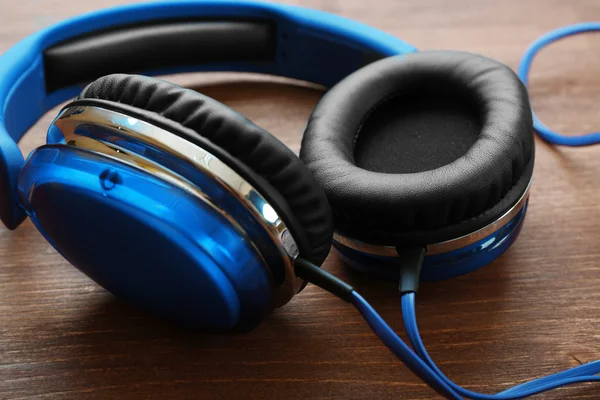 Headphones on wooden background — Stock Photo, Image