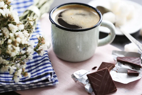 Cup of flavored coffee with chocolate on table with napkin, closeup — Stock Photo, Image