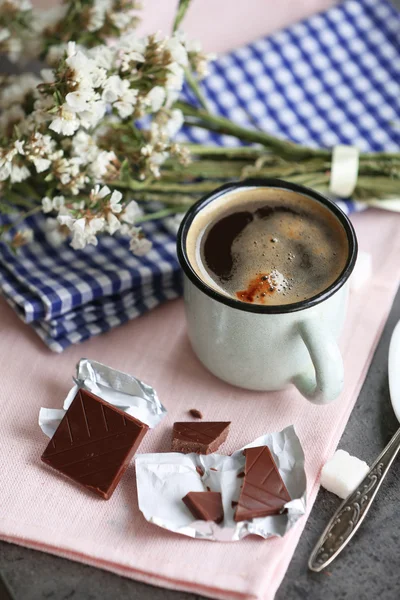 Cup of flavored coffee with chocolate on table with napkin, closeup — Stock Photo, Image