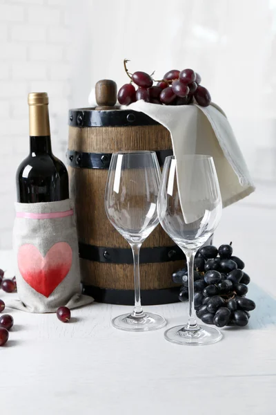 Beautiful still life with wine and grape on table — Stock Photo, Image